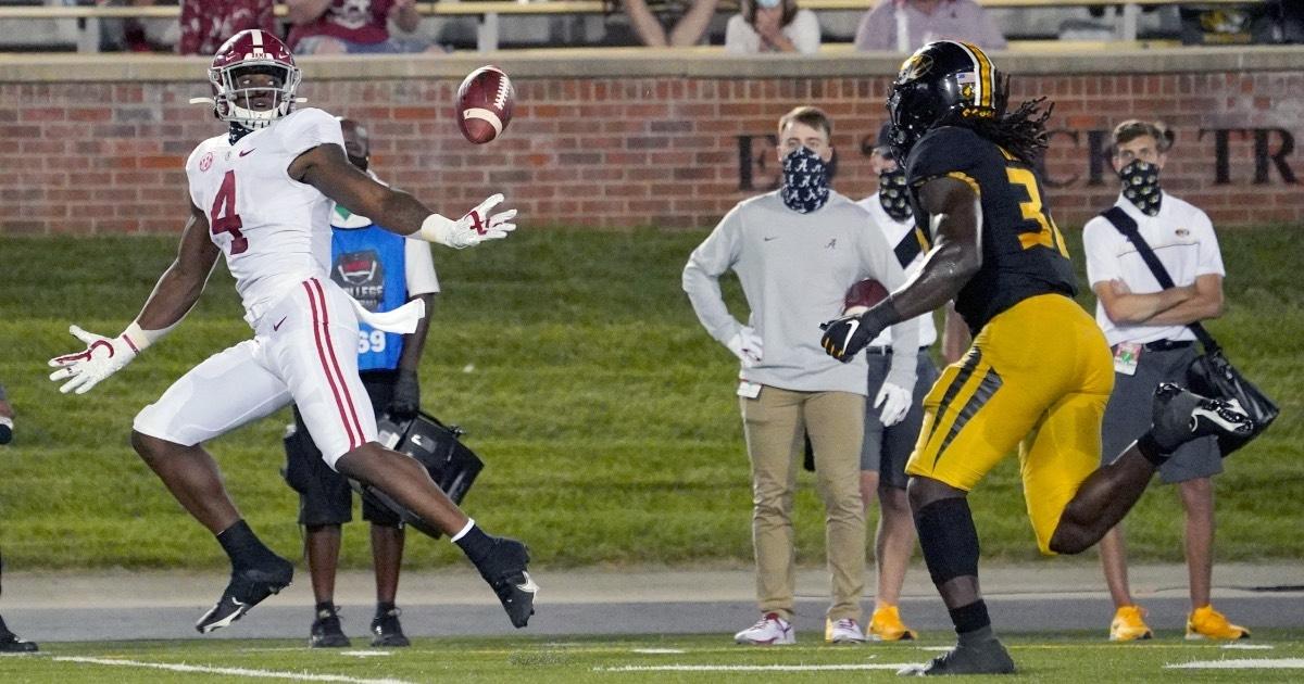 Alabama's Jaylen Waddle stretches to make a catch against Missouri.