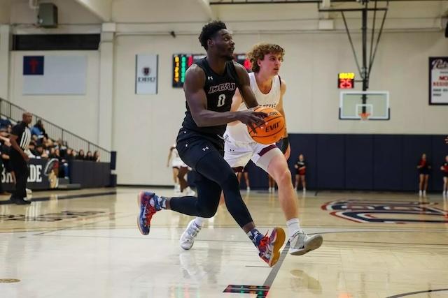 Xavion Brown drives to the basket in DII men's basketball.