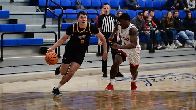 Cam Lowe drives the basketball for Black Hills State.